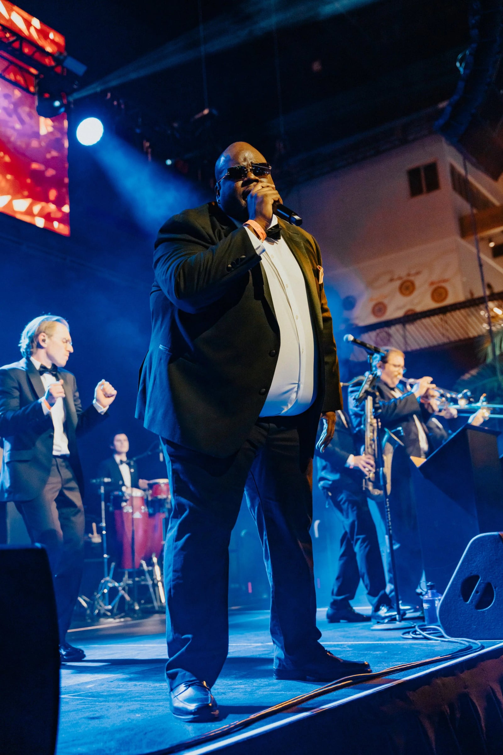 The A-List vocalists performing outdoors.