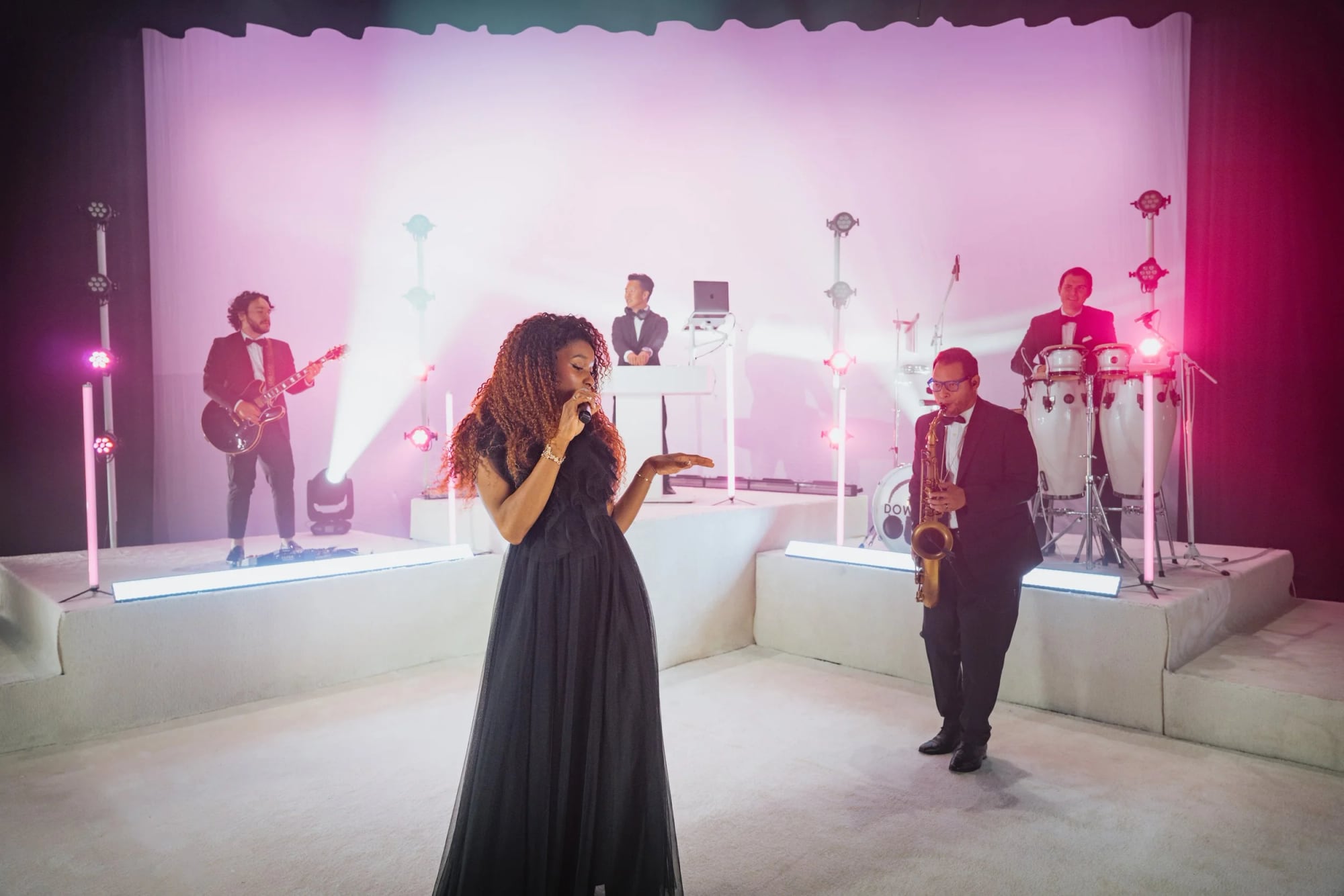 Le Chíc performing live at an event.