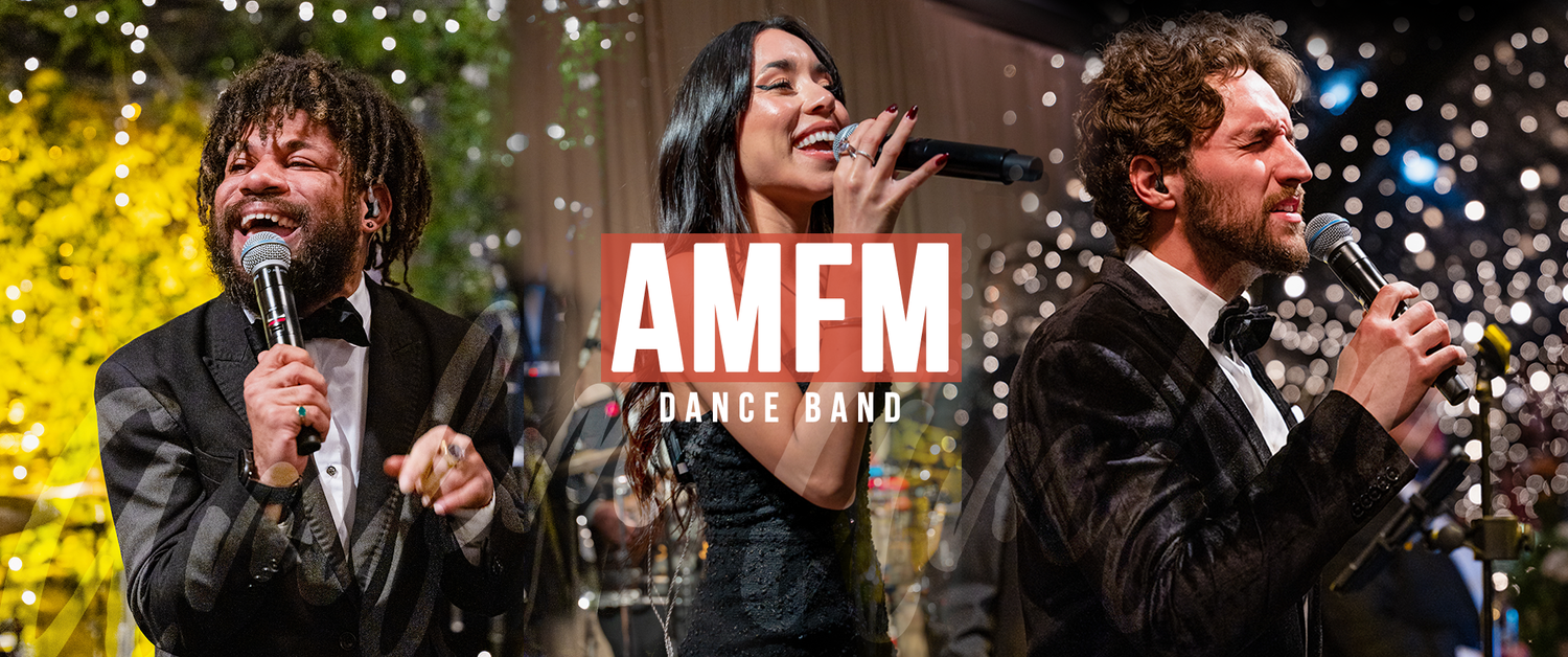AMFM vocalists performing live on stage.