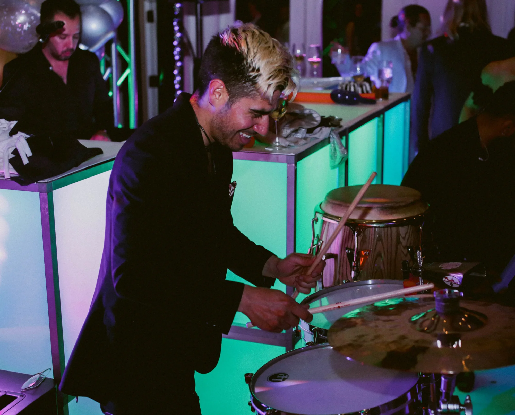 A percussionist playing live alongside the DJ.