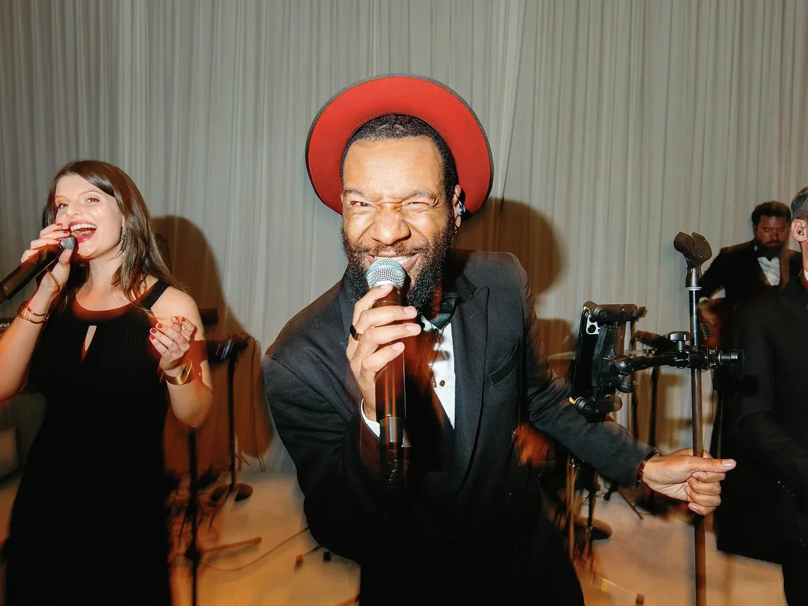 Gold Standard vocalists performing together.