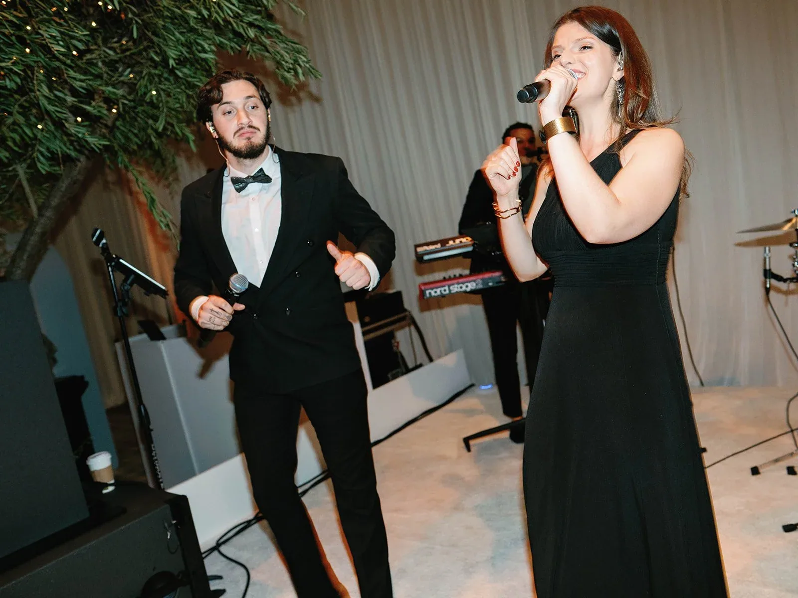 A Gold Standard vocalist performing beside the band.