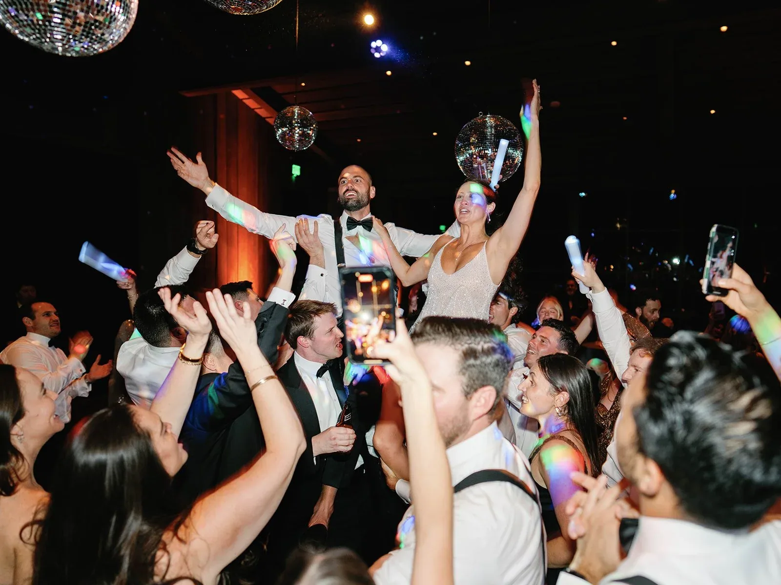 Gold Standard performing in the center of a crowded dance floor.
