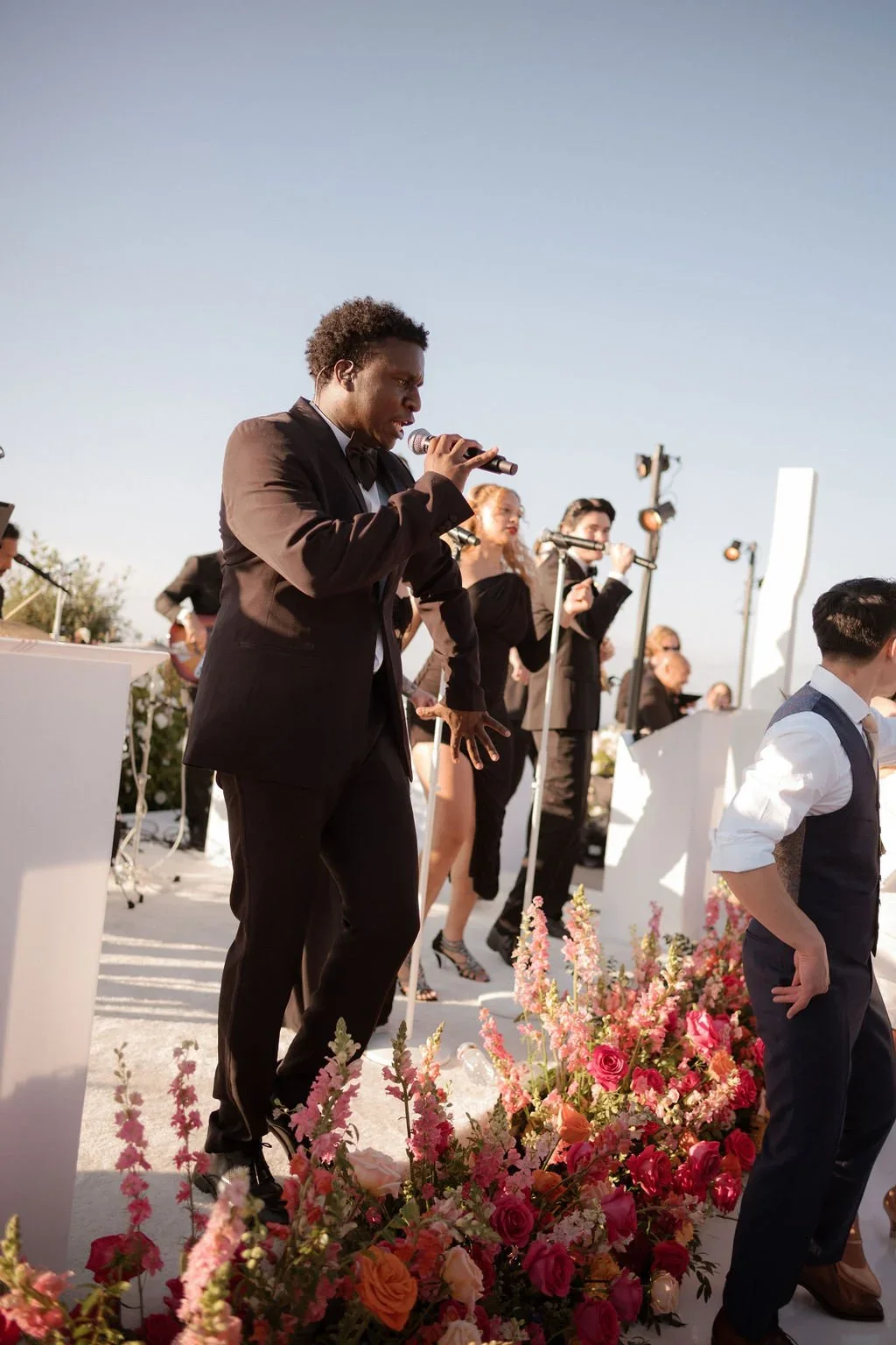 A Soultones vocalist performing beside the dance floor.