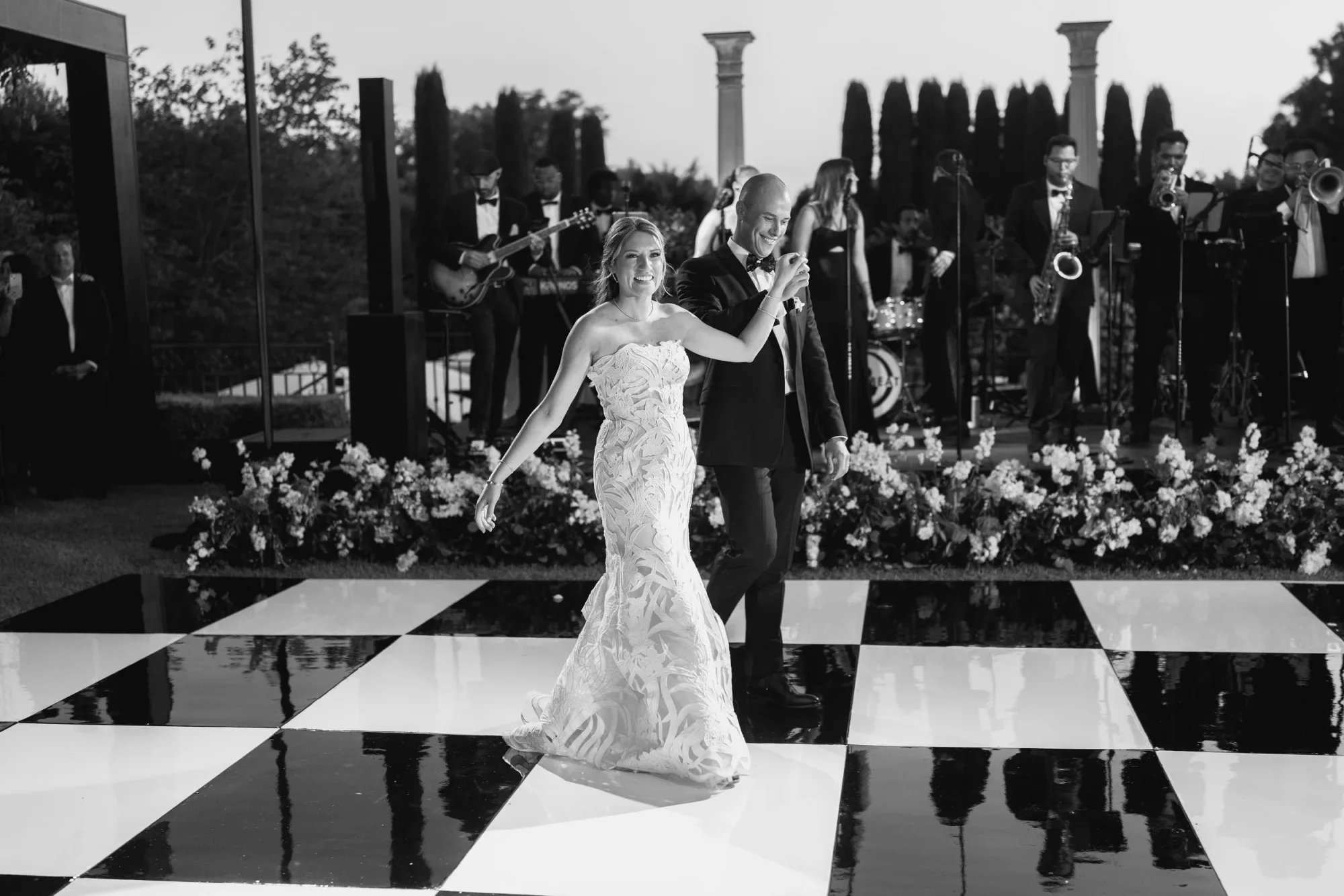 A black and white first dance with Soultones performing behind the couple.