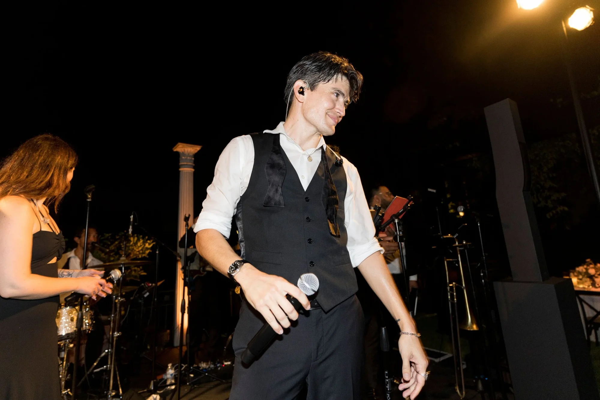 A Soultones vocalist performing at the edge of the stage.