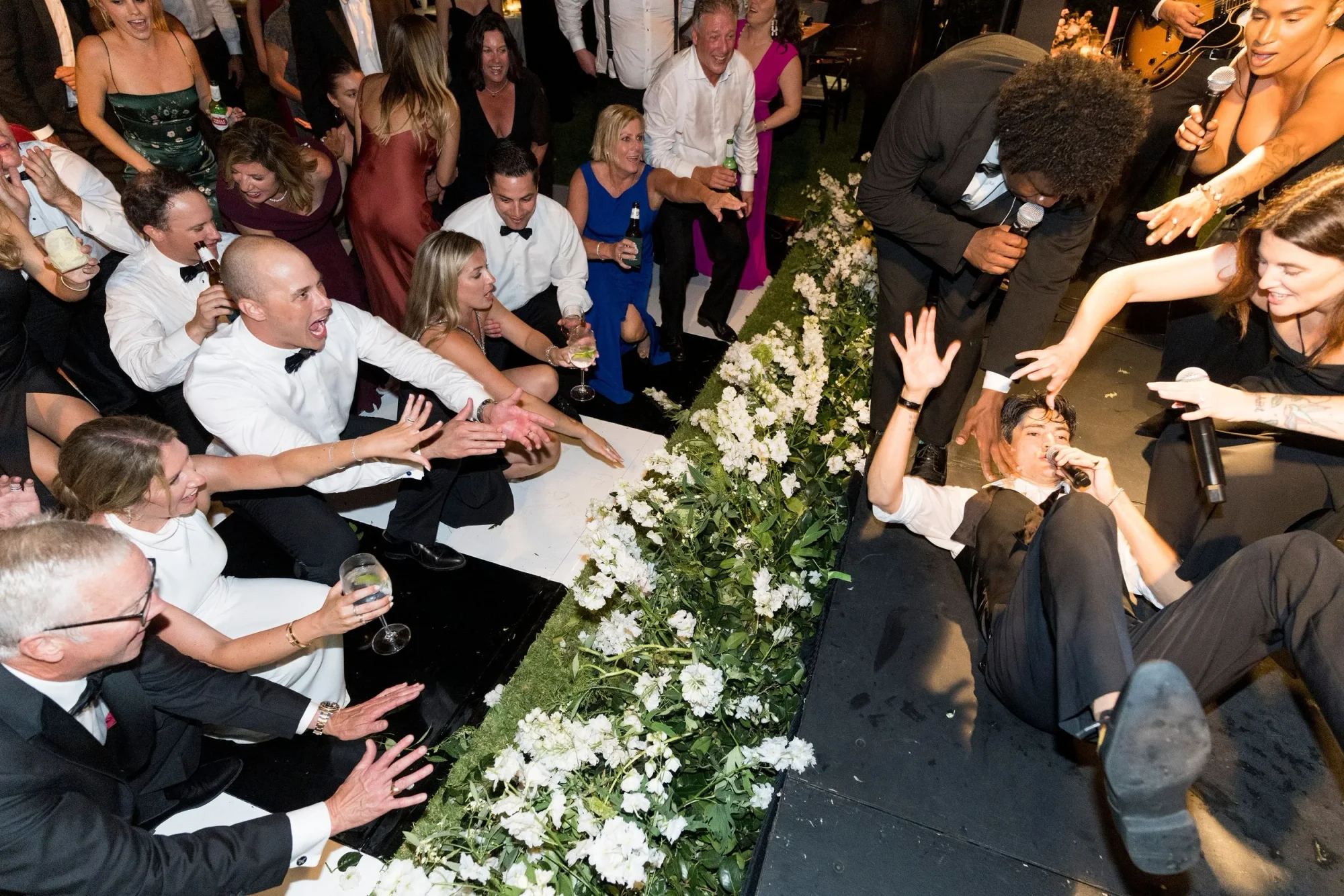A crowd surrounding the couple on the dance floor.