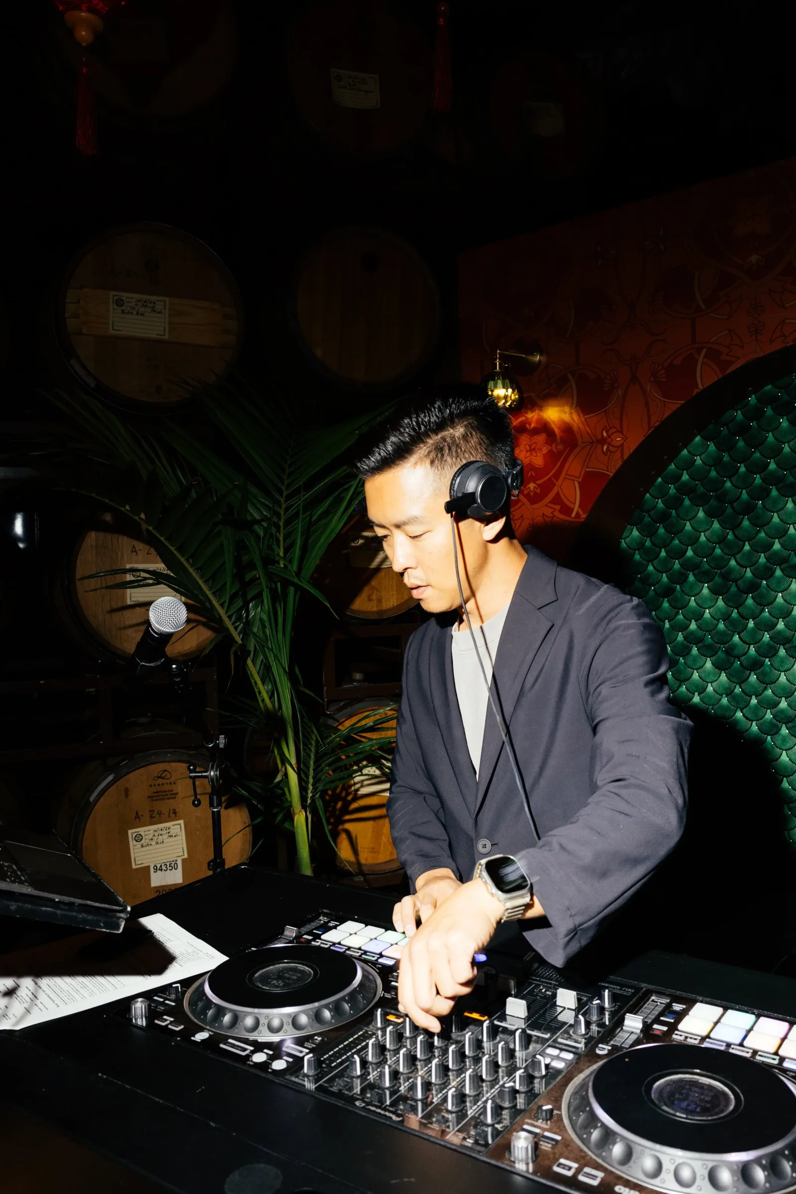 DJ Andrew performing behind the decks.