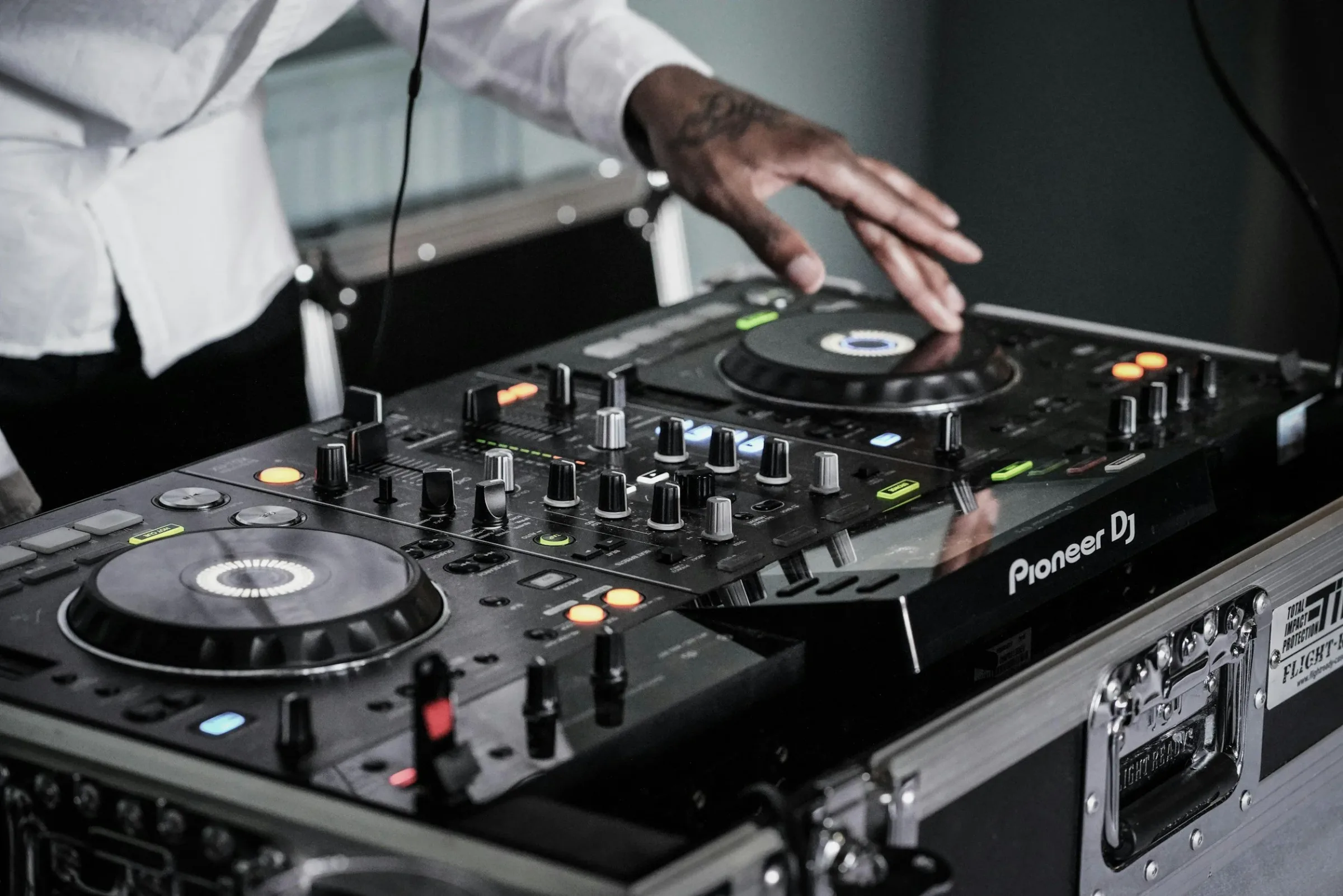 A DJ performing on Pioneer decks at a Downbeat event.