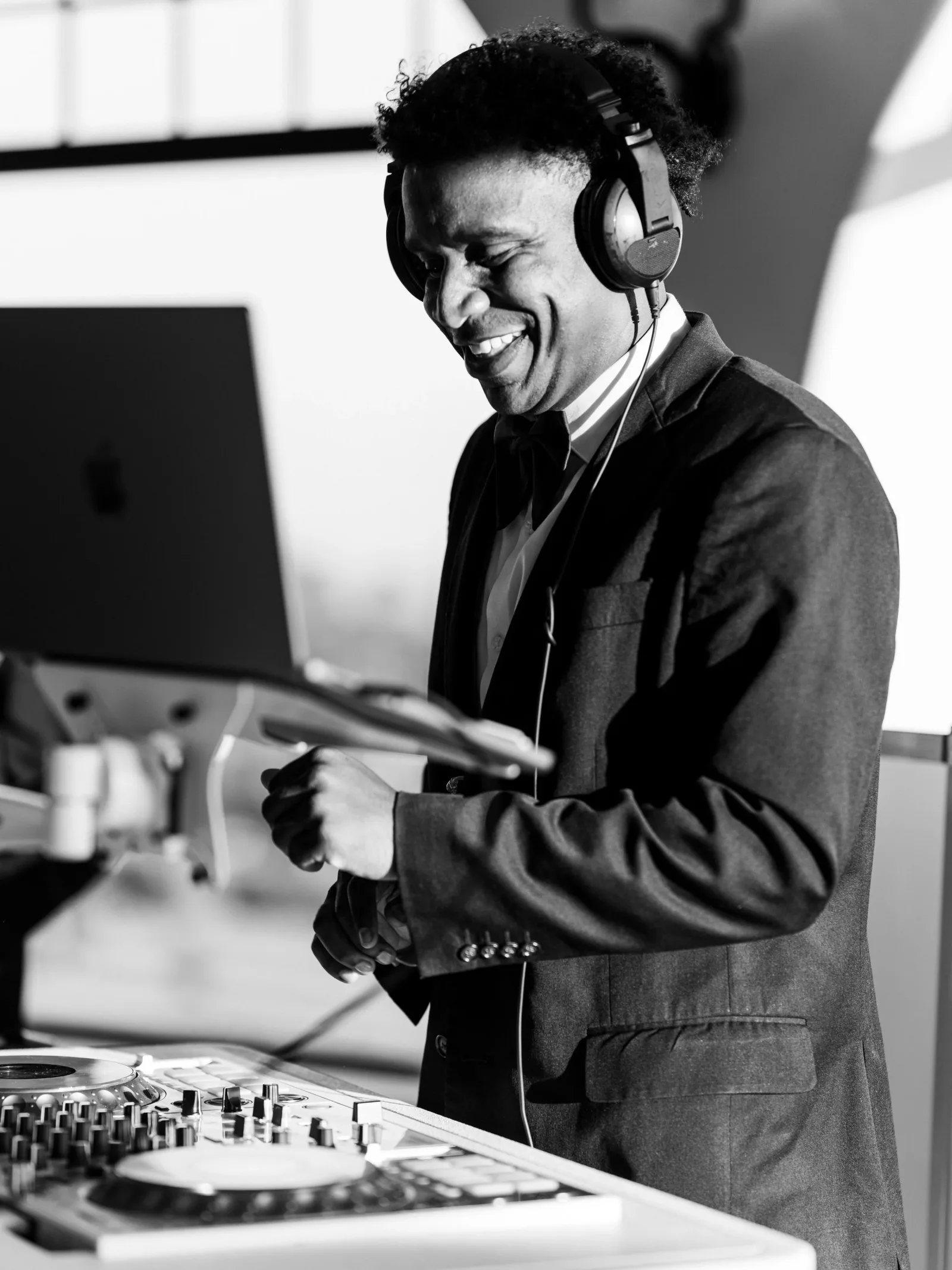 DJ Joel performing behind the decks.